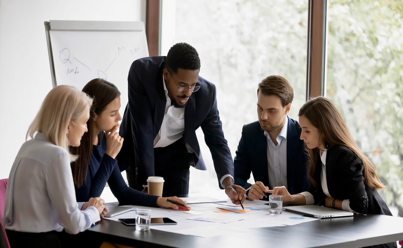 Reviewer panel deliberating over a candidate work sample